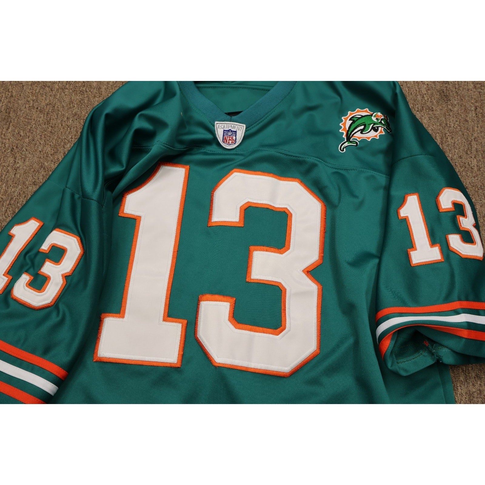 Close-up of Marino nameplate and stitched number 13 on jersey back
