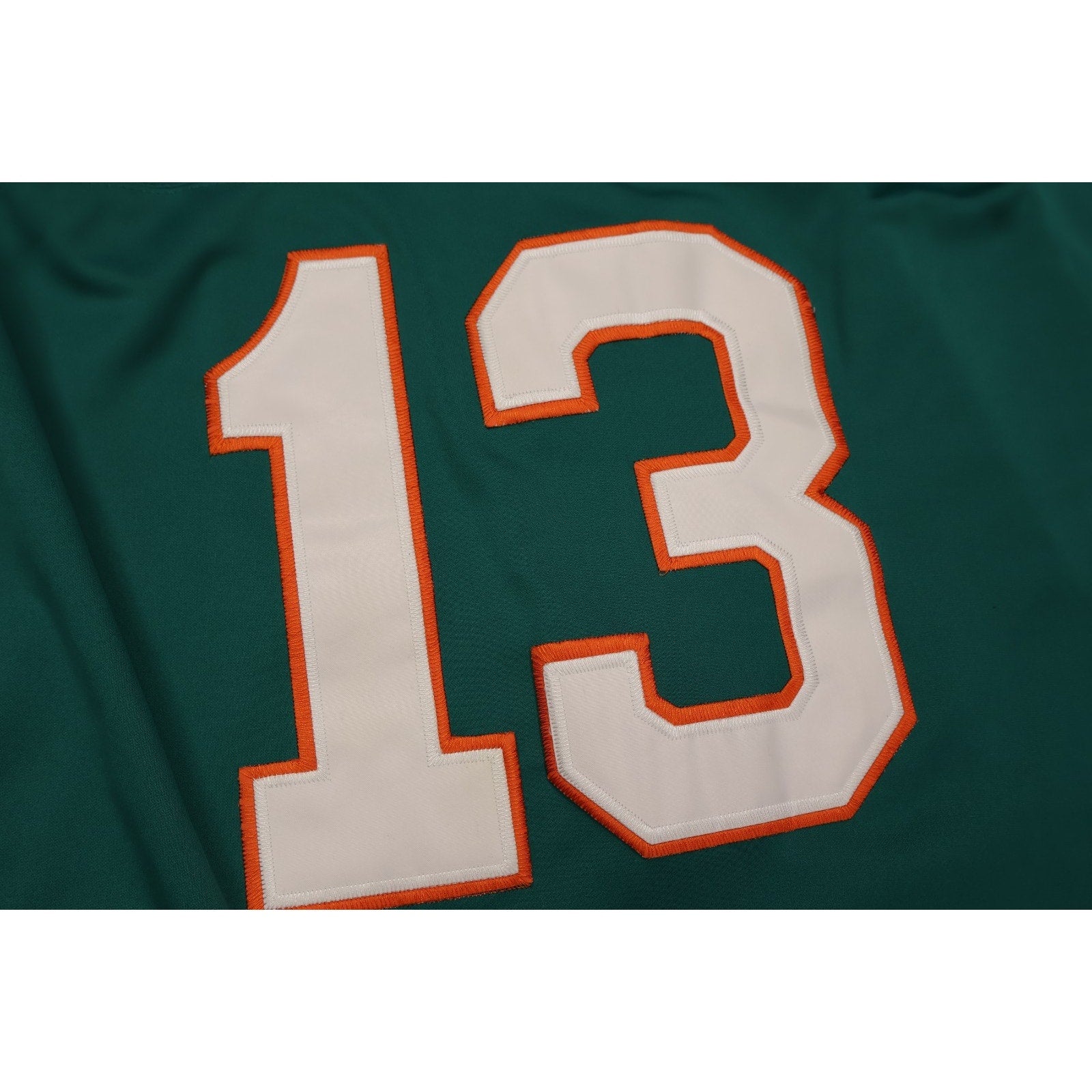 Detailed close-up of stitched number 13 on Dan Marino Dolphins jersey