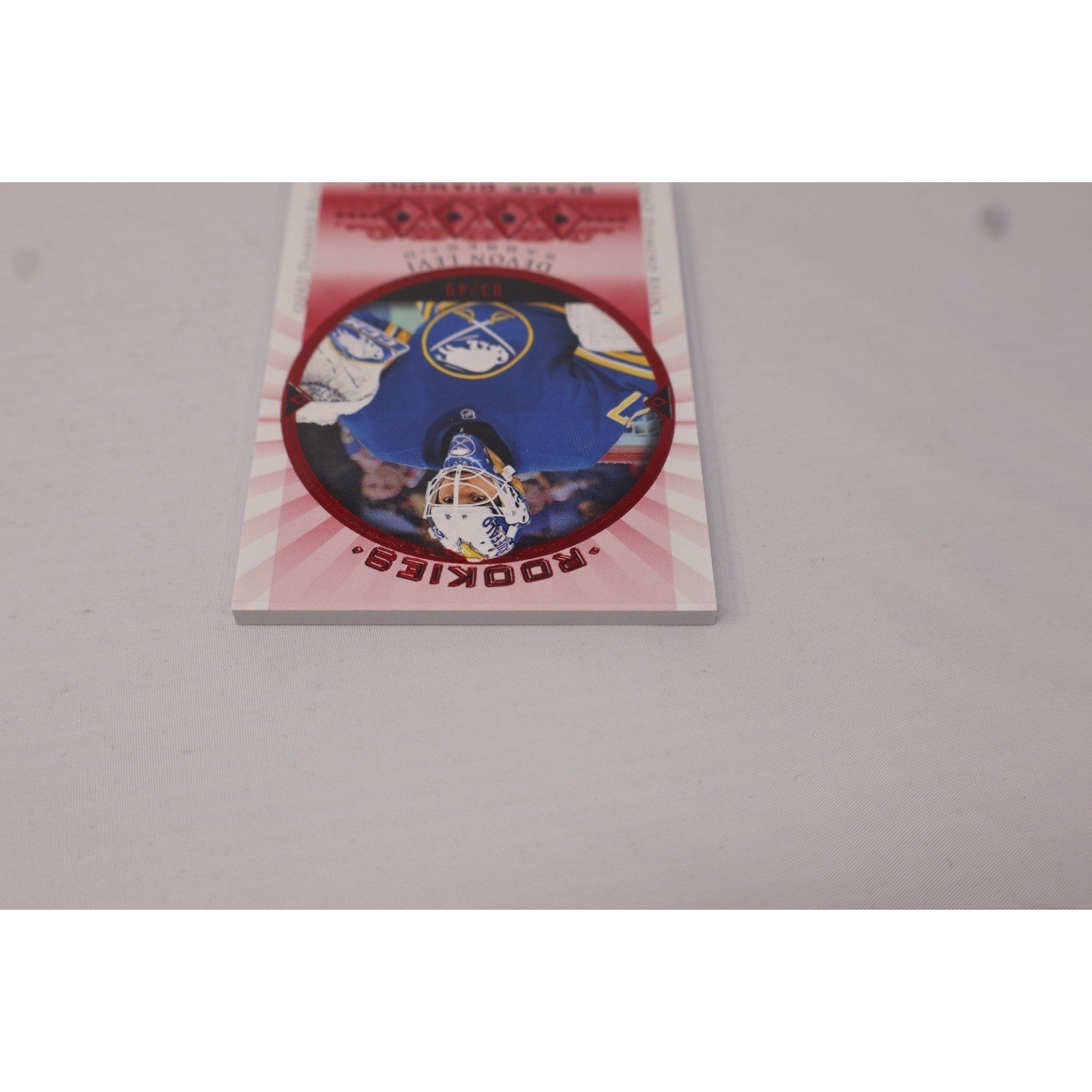 Additional front view of Devon Levi Rookie Quad Gems Relics Ruby RC in protective holder