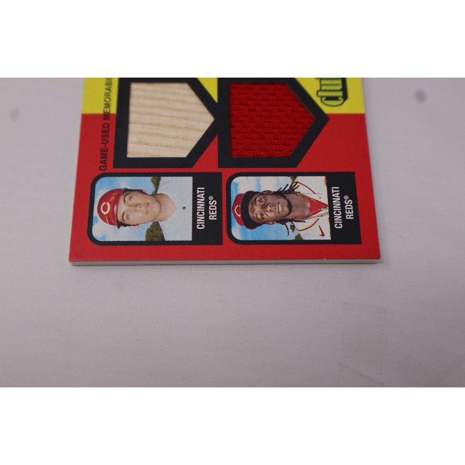 Close-up of dual relic swatches and player portraits on Johnny Bench and Elly De La Cruz Clubhouse Collection card