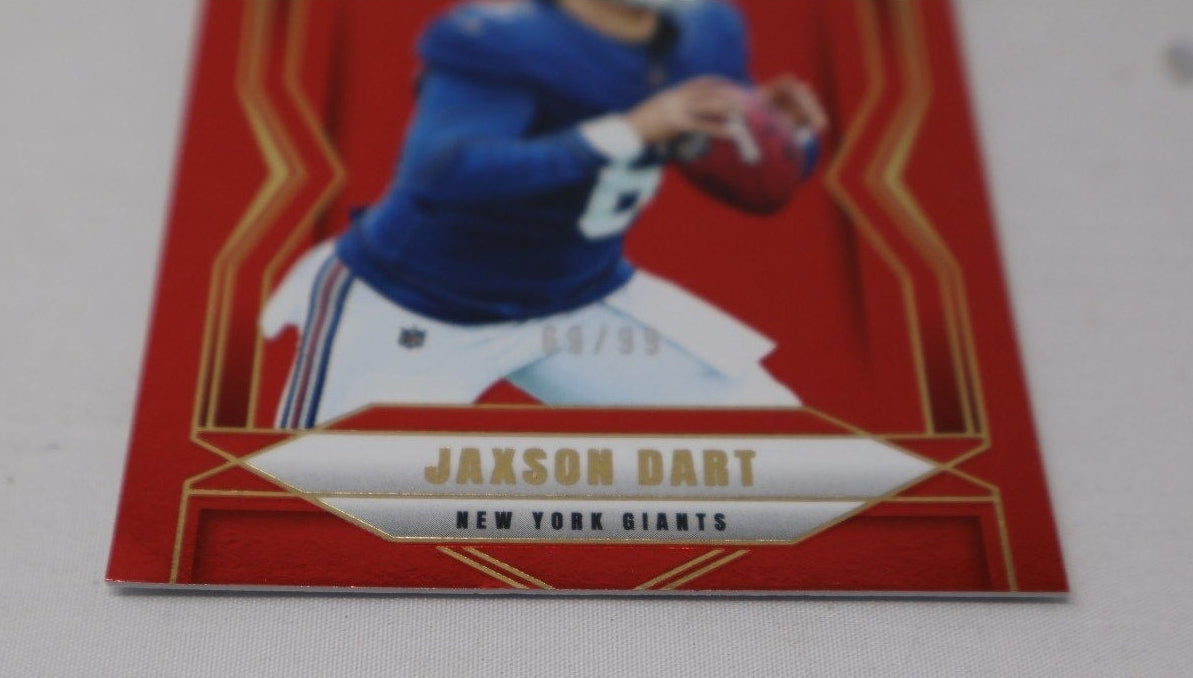Close-up of the red parallel design and rookie card numbering on Jaxson Dart trading card