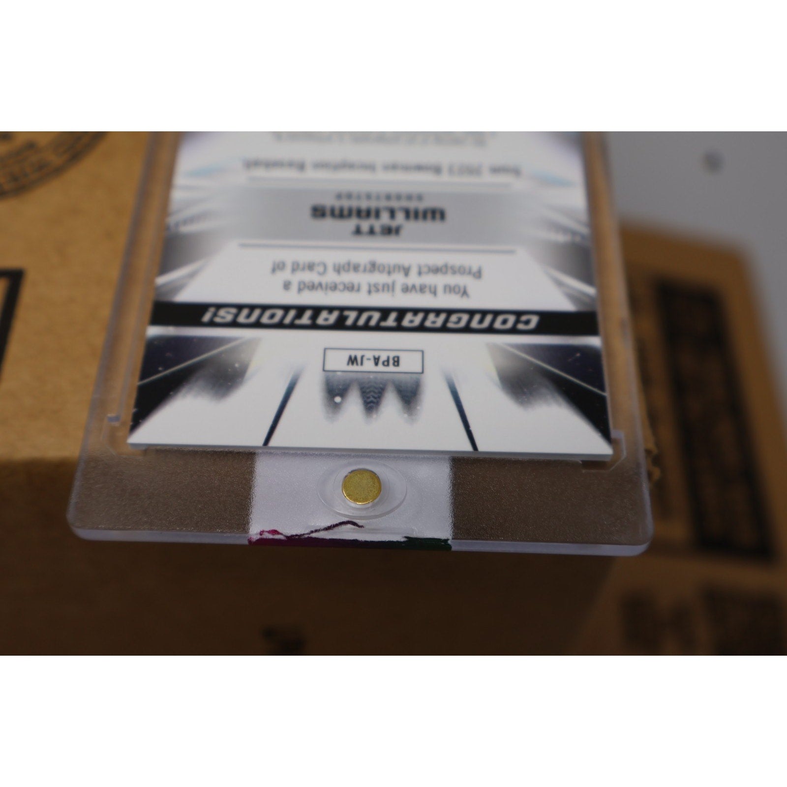 Angled view of Jett Williams Bowman Inception autograph trading card in protective holder