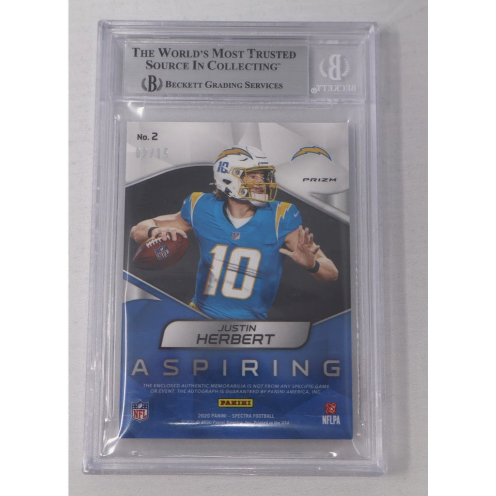 Back view of the 2020 Panini Spectra Justin Herbert Aspiring Patch Autographs Neon Purple rookie card showing serial numbering, authentication details, and Beckett grading slab