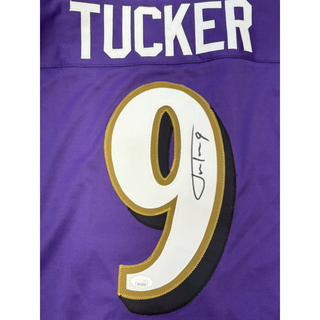 Close-up of Justin Tucker autograph and number 9 on Ravens jersey