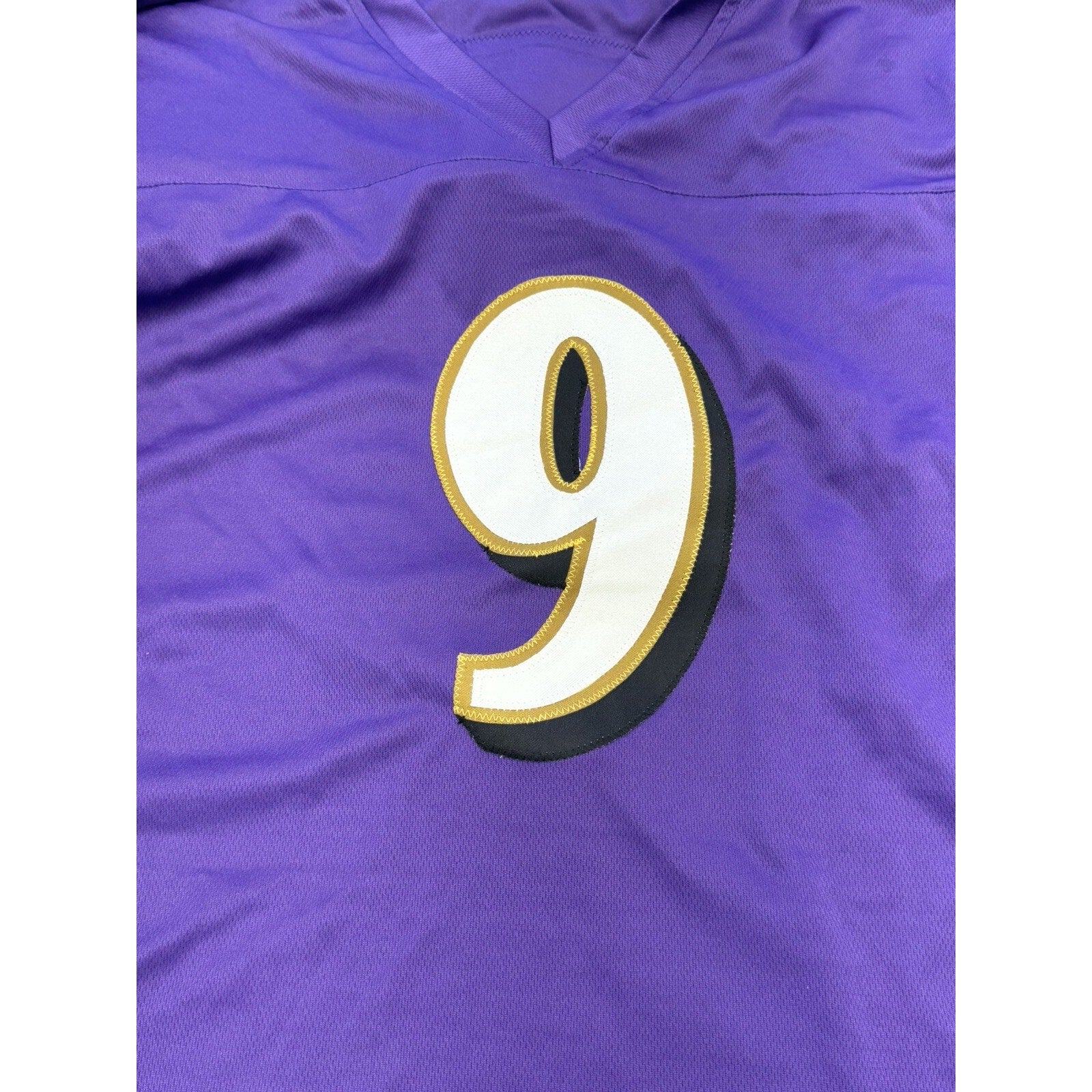 Close-up view of stitched number 9 on Justin Tucker Ravens jersey
