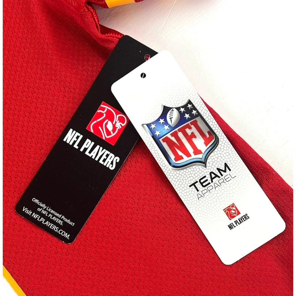 Official NFL merchandise tags attached to Kansas City Chiefs youth jersey