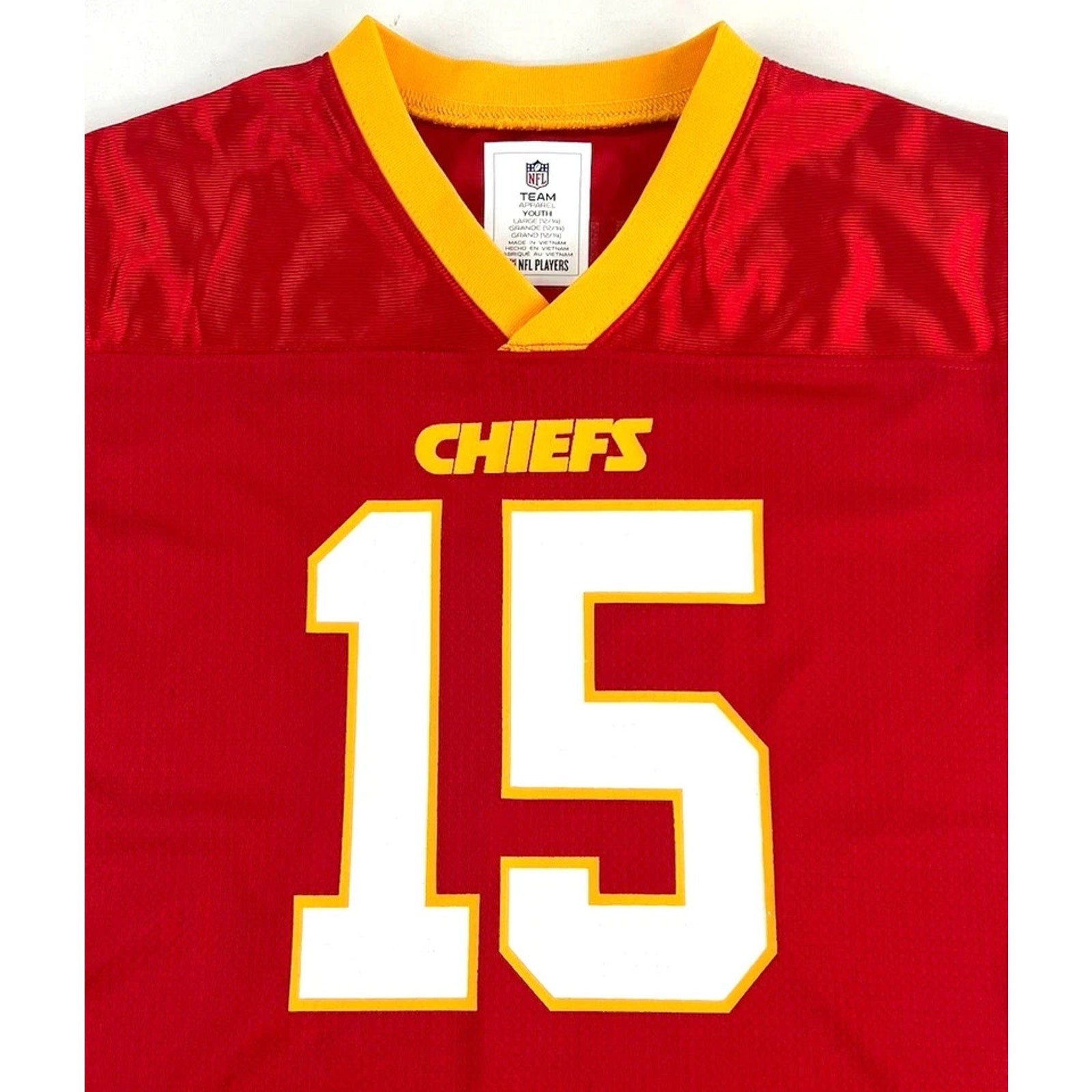 Front close-up of Patrick Mahomes Chiefs kids jersey featuring number 15
