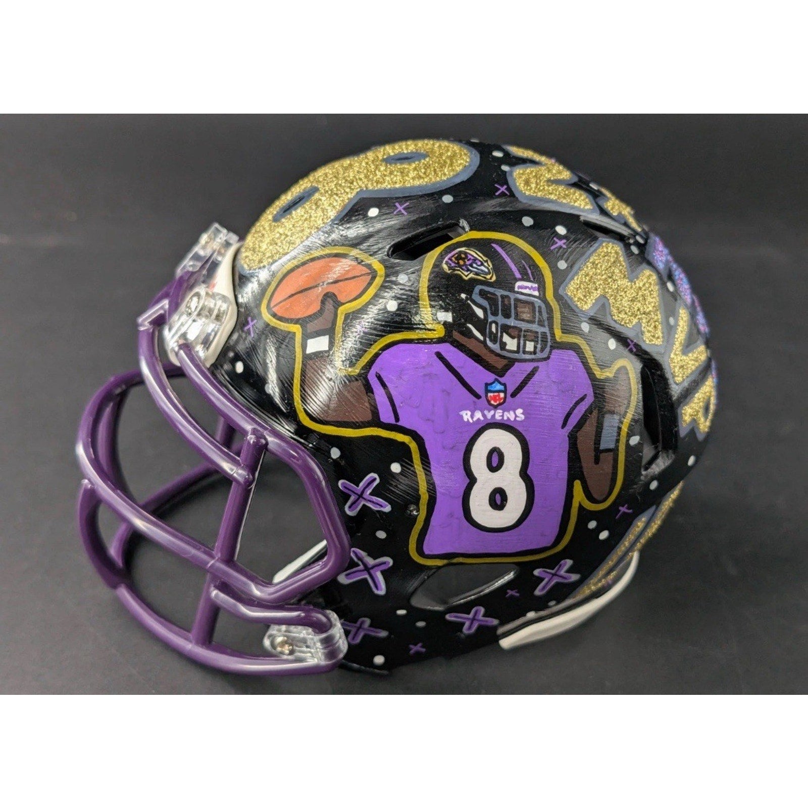 Side angle view of custom Lamar Jackson painted Baltimore Ravens mini helmet collectible