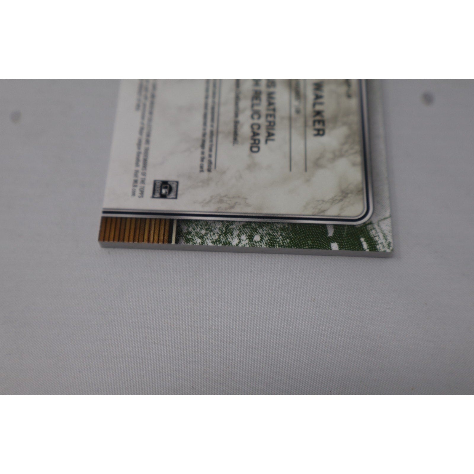 Additional back edge and condition detail photo of Topps Museum Collection relic card