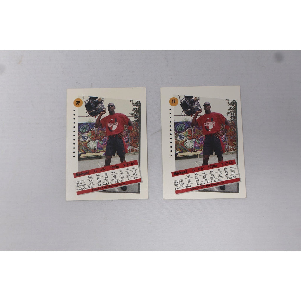 Back view of two 1991 SkyBox Michael Jordan #39 trading cards showing player stats and card details