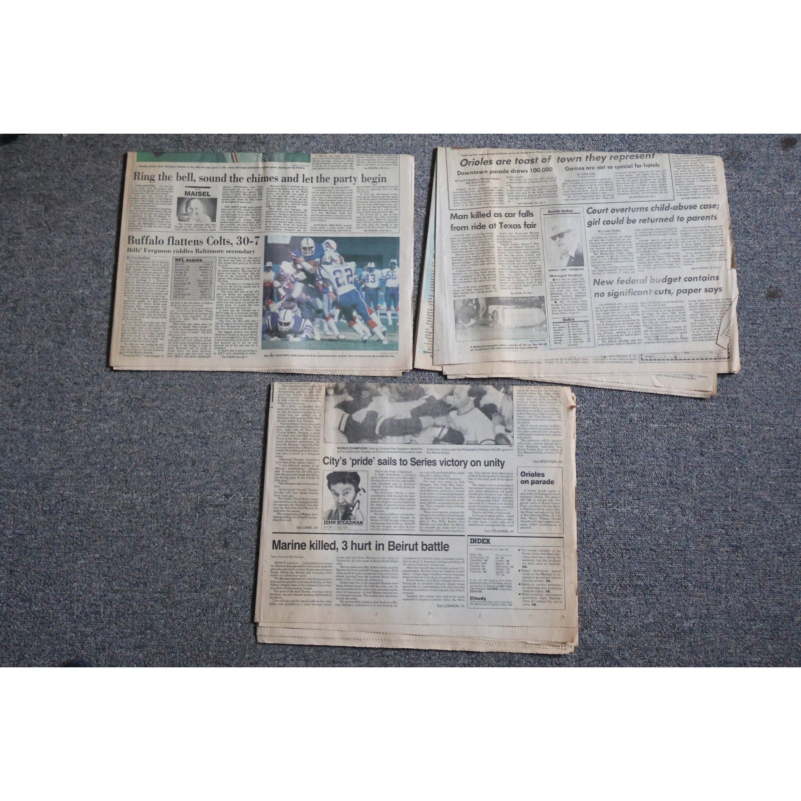 Top view of Baltimore Orioles 1983 World Series championship newspaper collectibles and commemorative pages