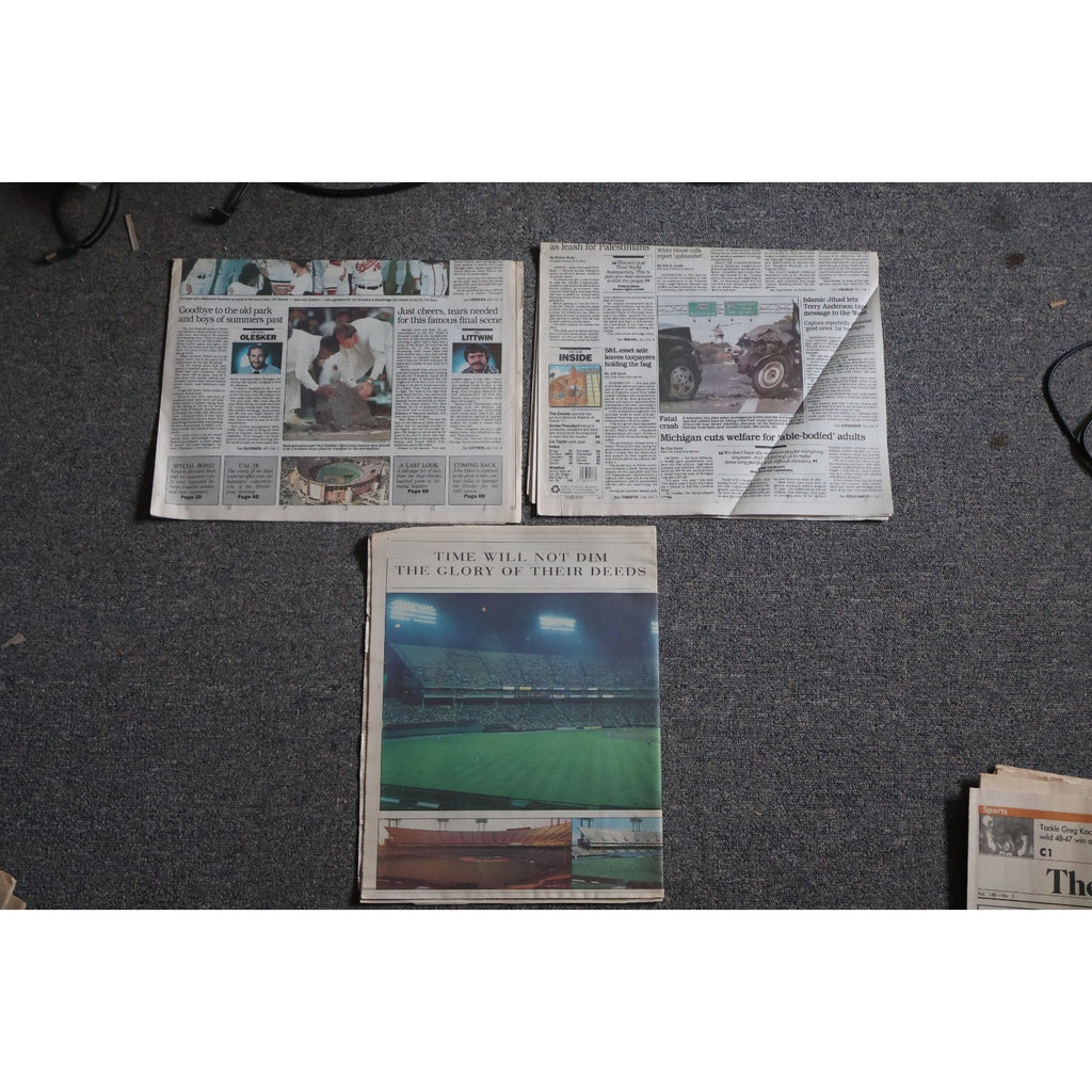 Top view of Baltimore Orioles Memorial Stadium farewell newspapers and commemorative collectibles