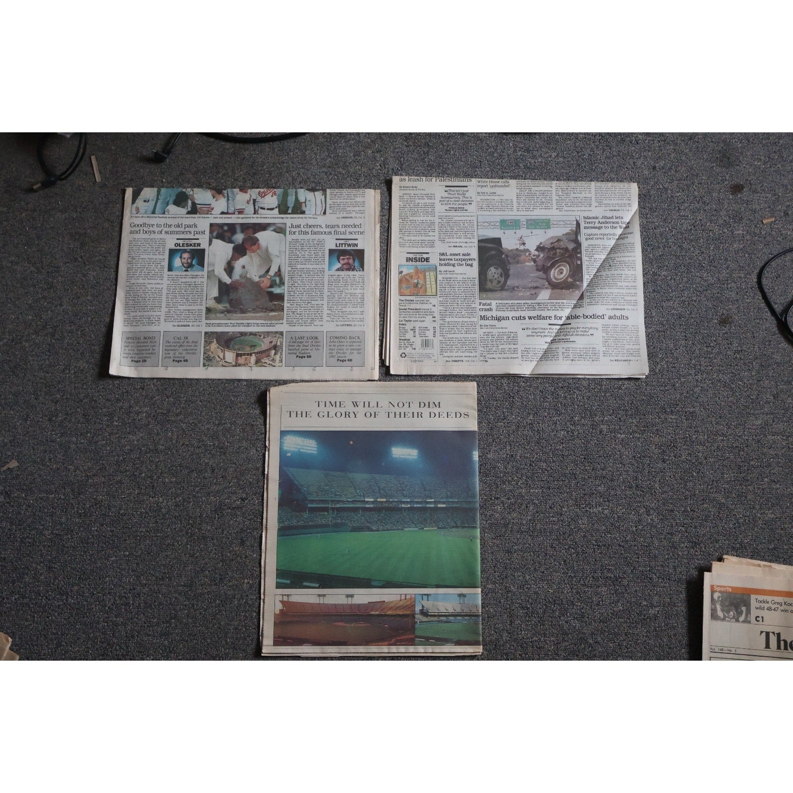 Top view of Baltimore Orioles Memorial Stadium farewell newspapers and commemorative collectibles