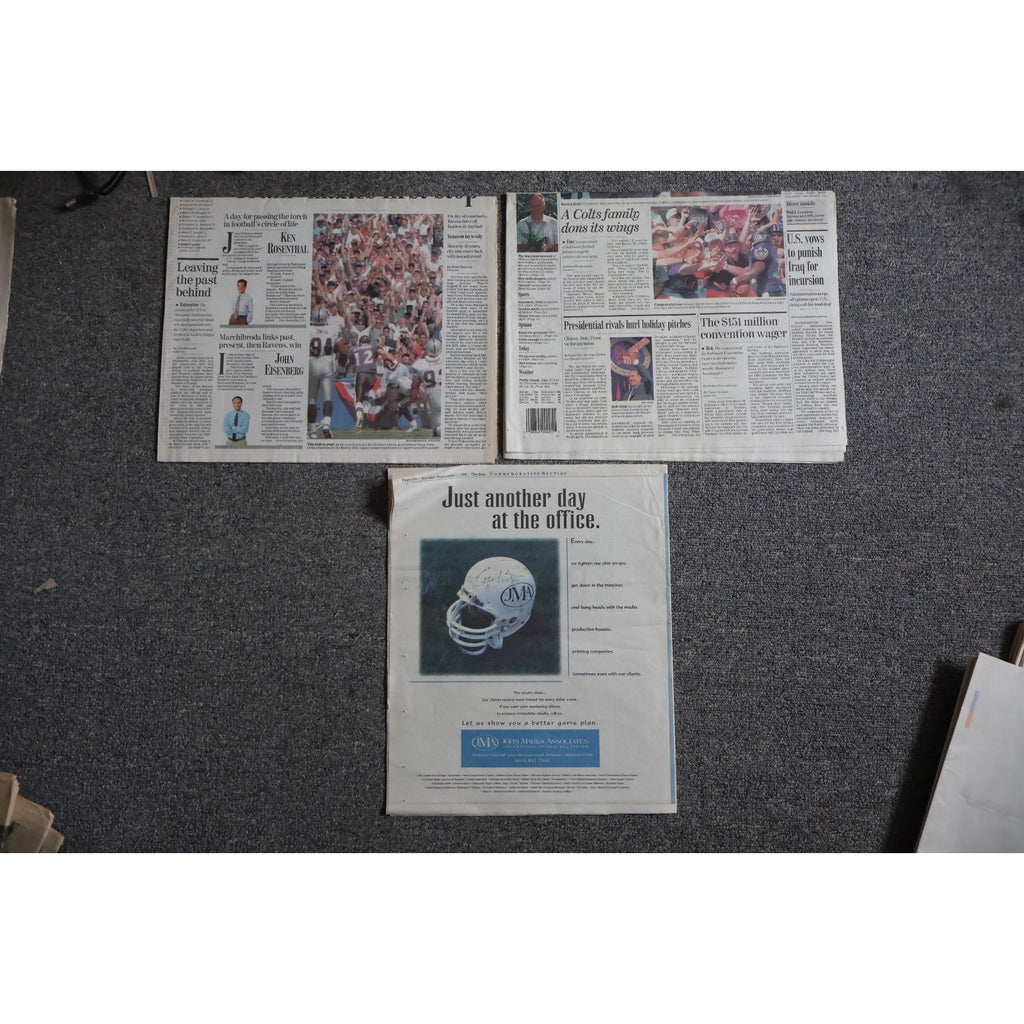 Top view of Baltimore Ravens first game 1996 commemorative newspaper collection and memorabilia