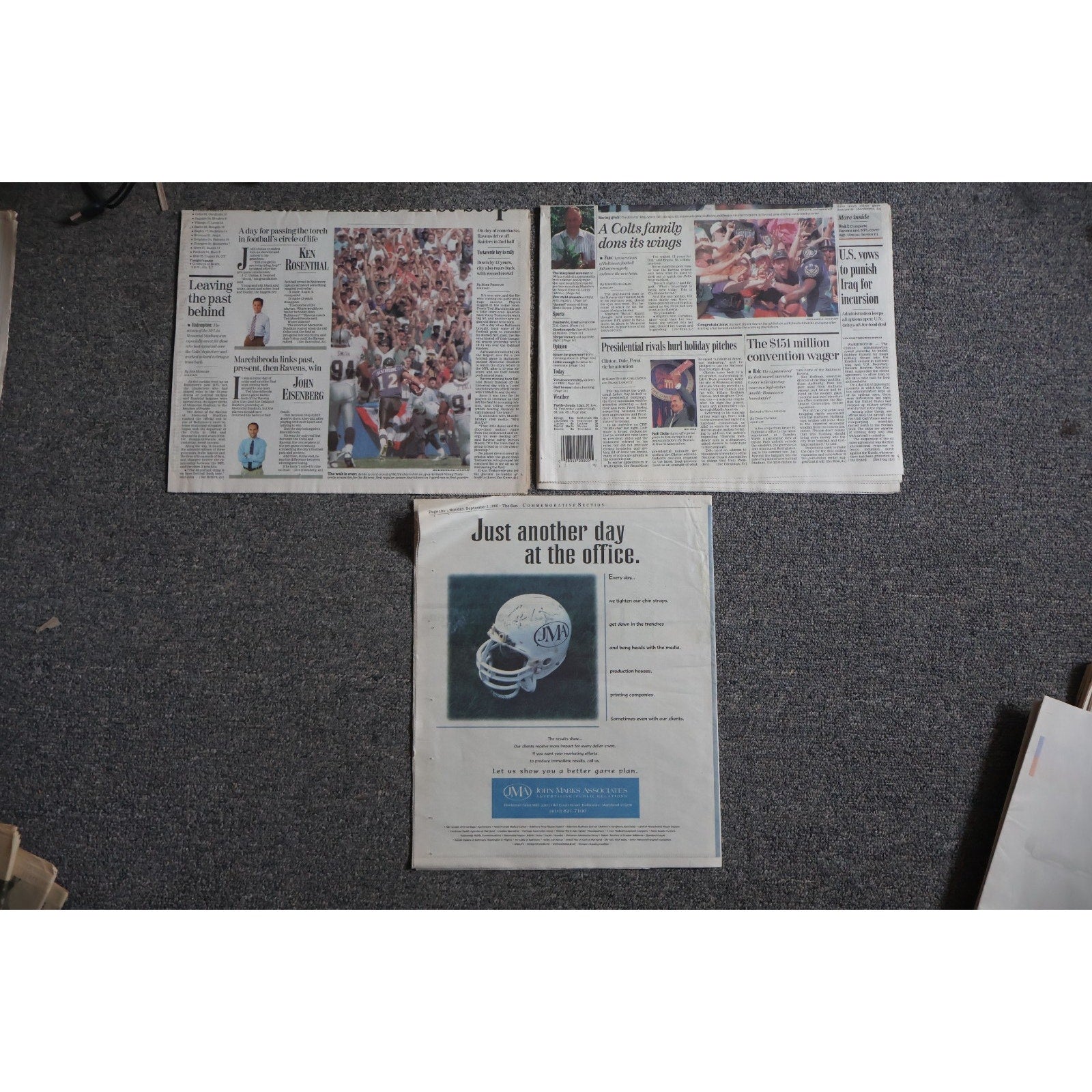 Top view of Baltimore Ravens first game 1996 commemorative newspaper collection and memorabilia