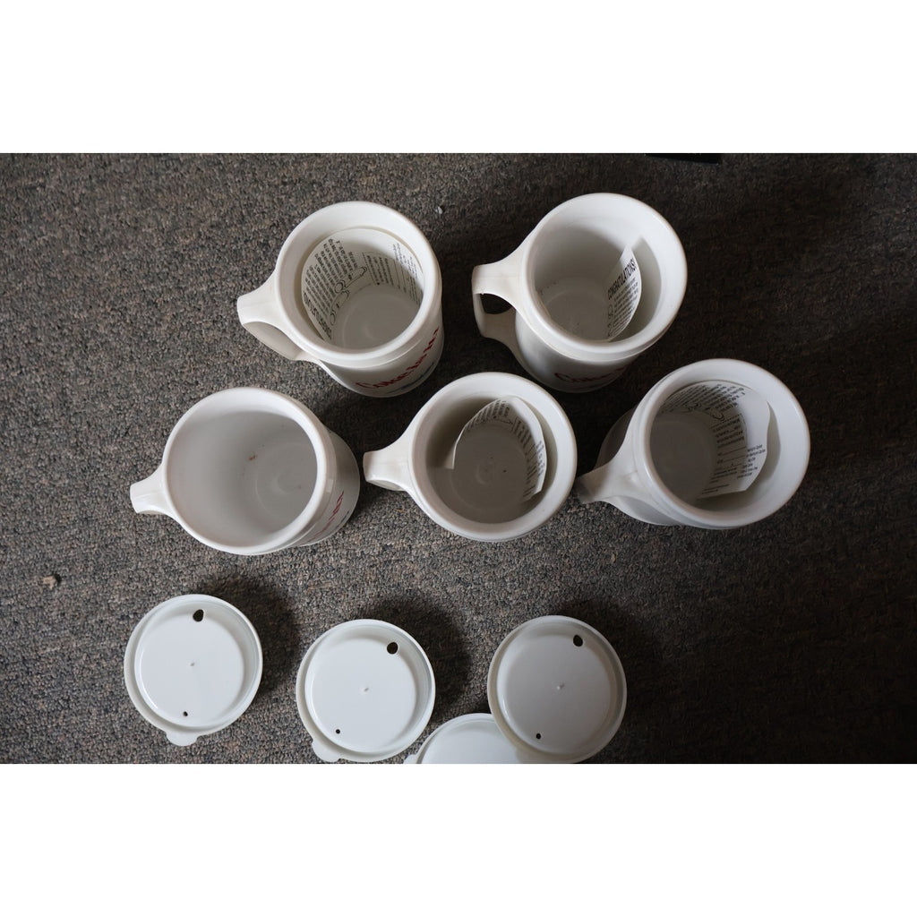 Top view of vintage Washington Capitals anniversary plastic mugs with matching covers
