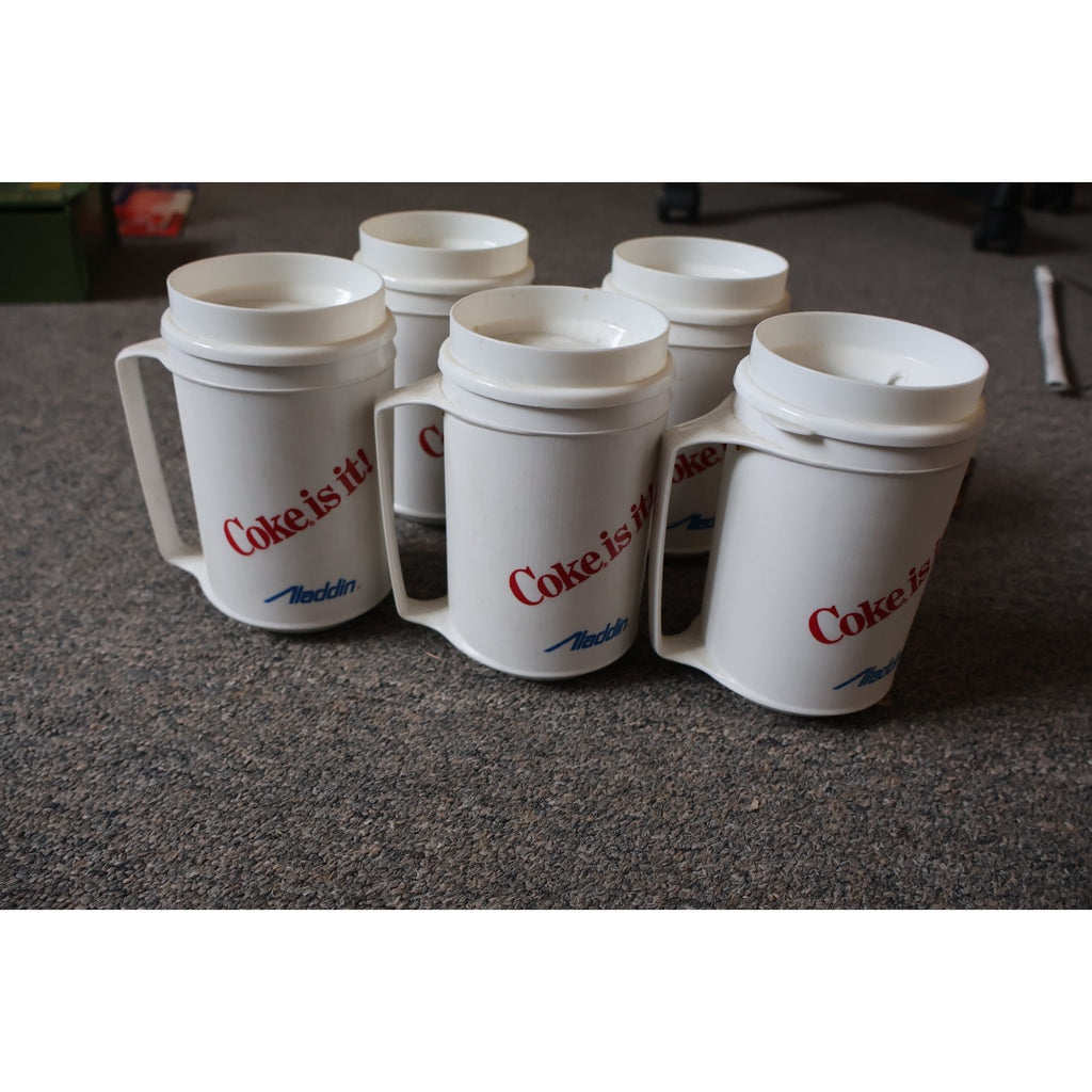 Side angle view of vintage Washington Capitals plastic mugs featuring anniversary graphics