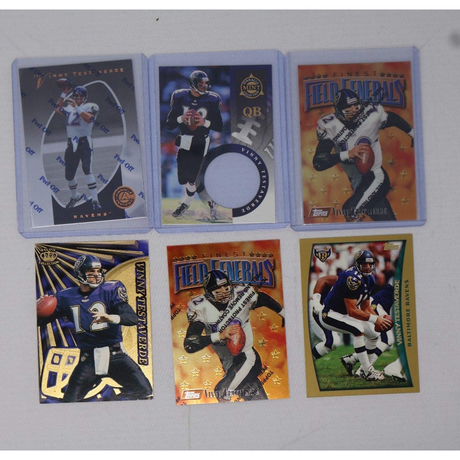 Lot of 6 Vinny Testaverde Baltimore Ravens insert football trading cards featuring multiple Ravens-era NFL card designs including memorabilia-style inserts in Near Mint condition