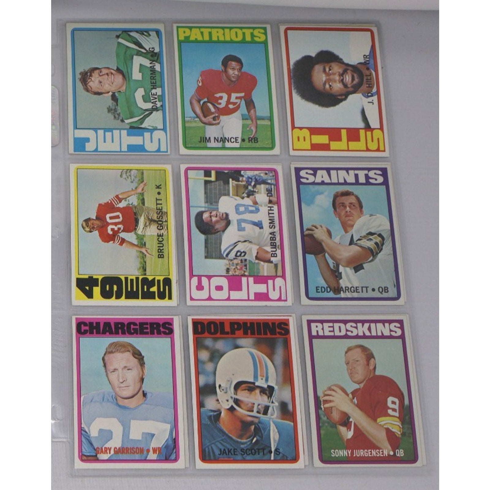 Lot of 9 vintage 1972 Topps football cards featuring NFL stars and Hall of Fame players including Sonny Jurgensen, Mike Scott, and players from the Patriots, Saints, Dolphins, Chargers, and Redskins