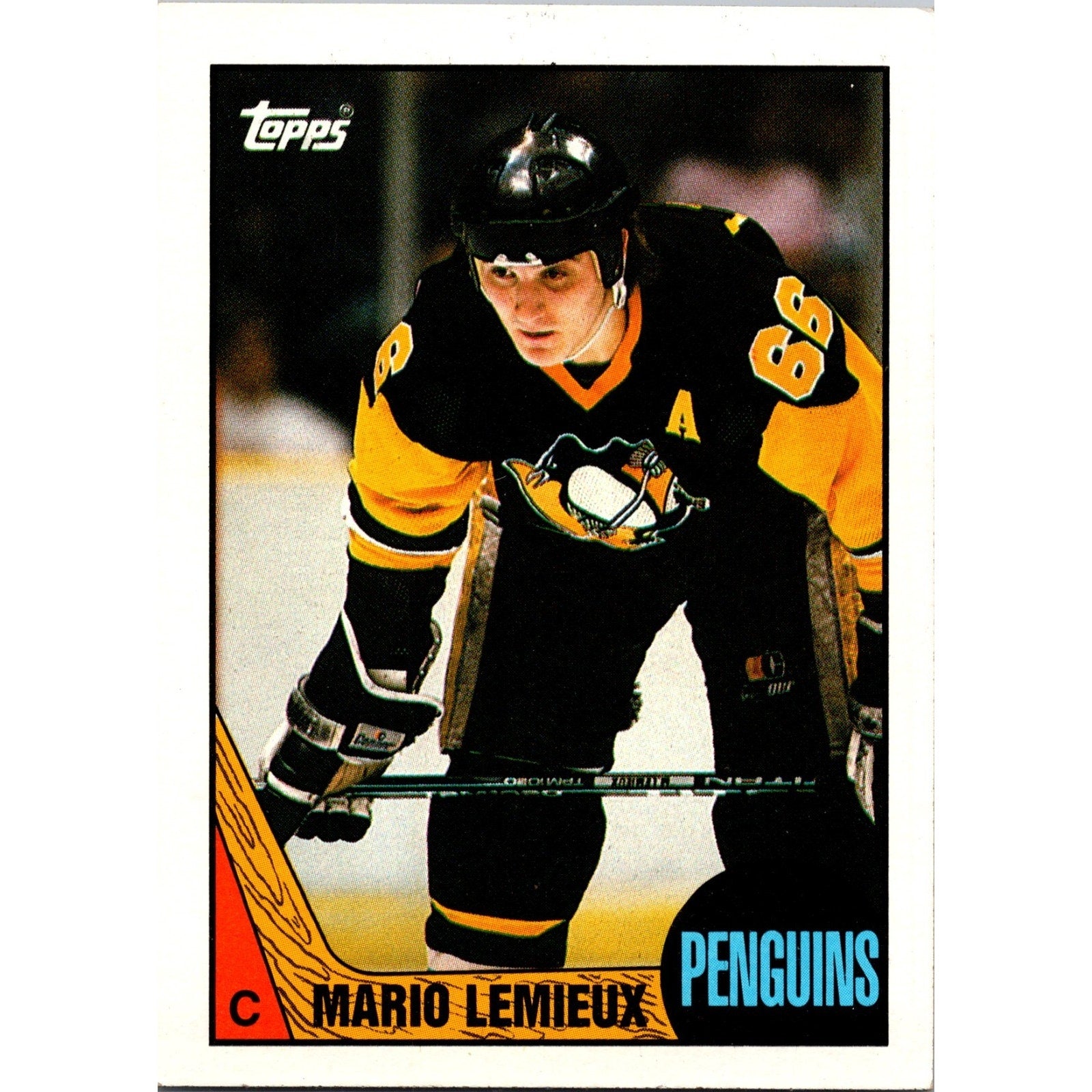 1987-88 Topps Mario Lemieux #15 hockey trading card featuring the Pittsburgh Penguins legend in black and gold uniform