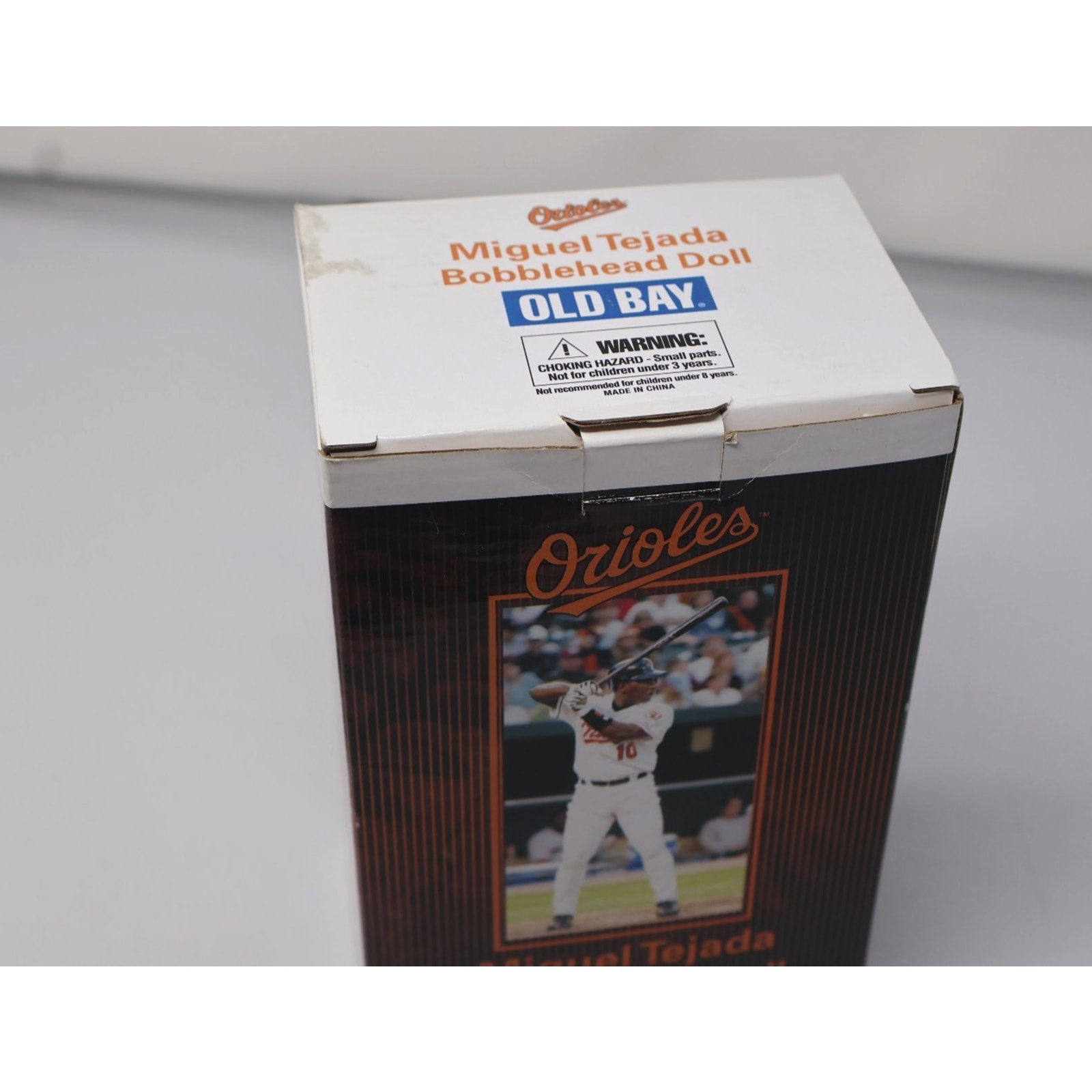 Top and angled view of unopened Miguel Tejada bobblehead box with Orioles branding