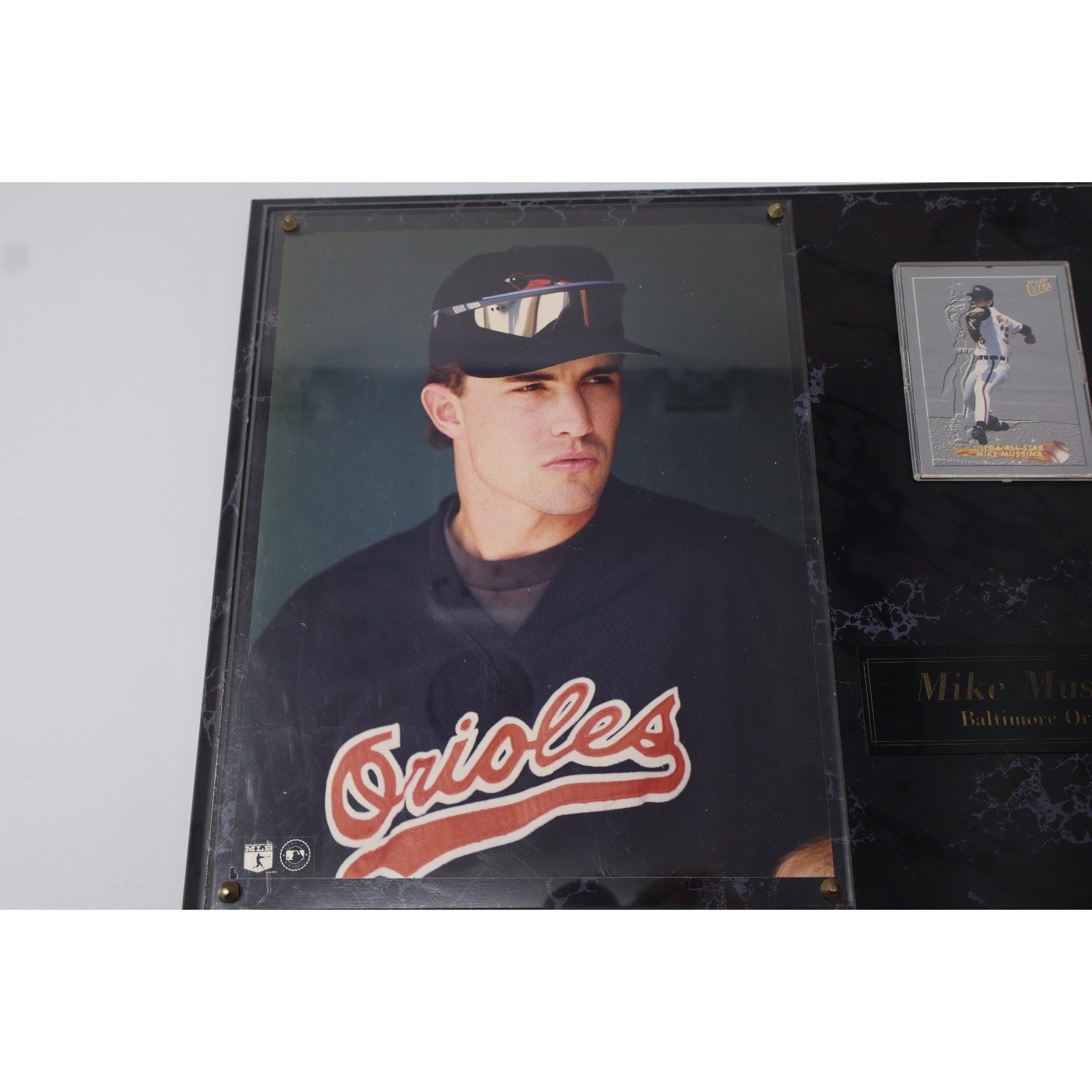 Close-up of Mike Mussina Baltimore Orioles photo featured on vintage wooden plaque collectible