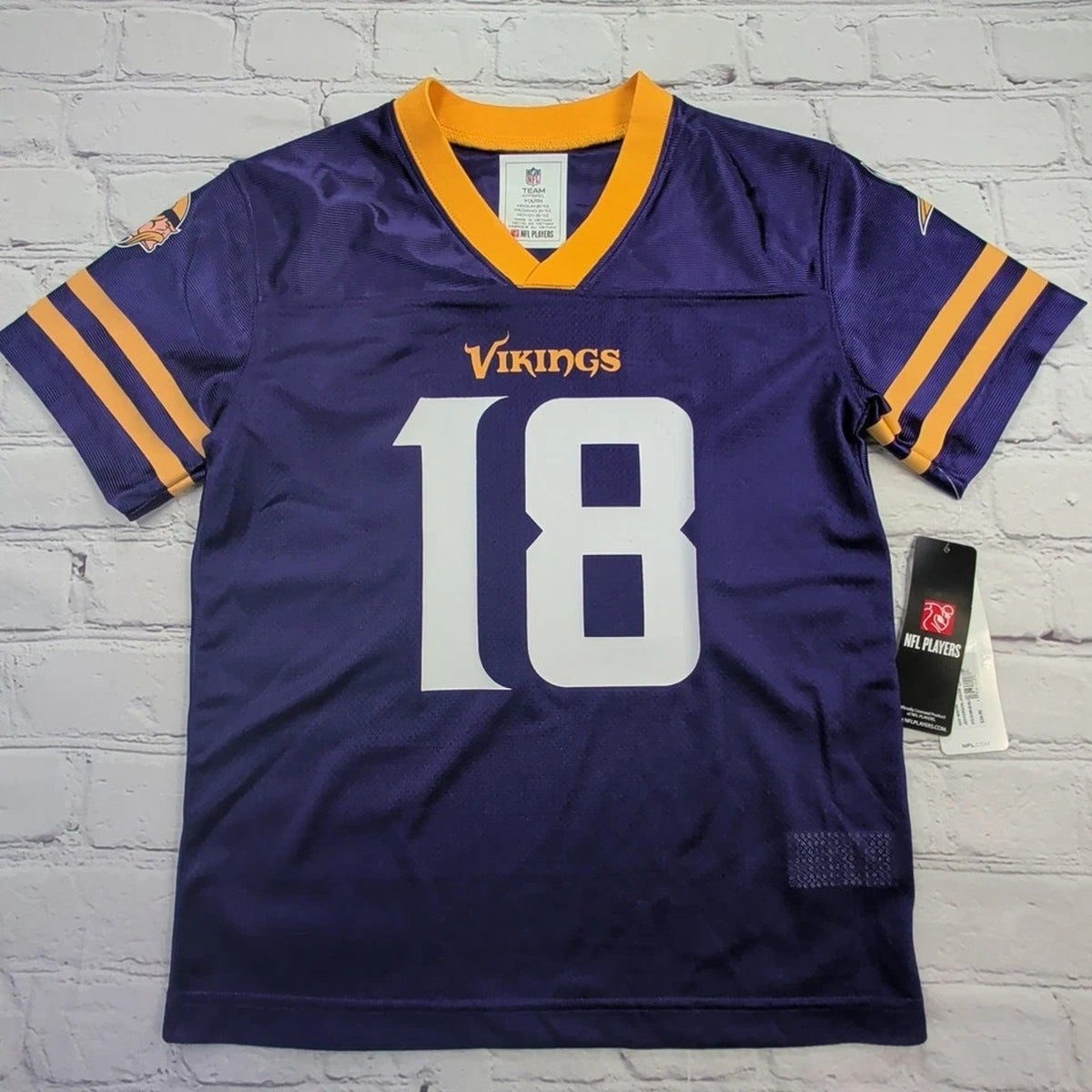 Minnesota Vikings Justin Jefferson youth home jersey in purple with number 18 and official team graphics