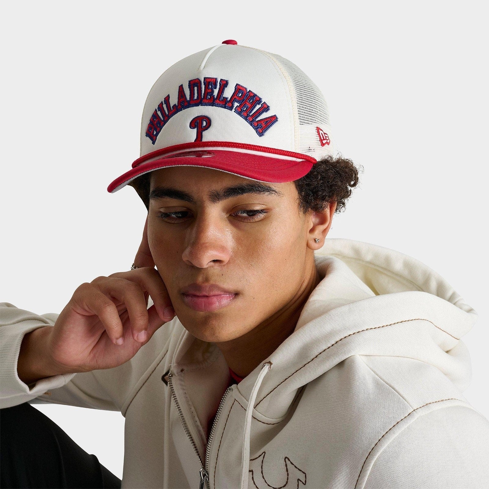 Model wearing New Era Philadelphia Phillies 9FORTY M-Crown snapback mesh cap with cream and red design