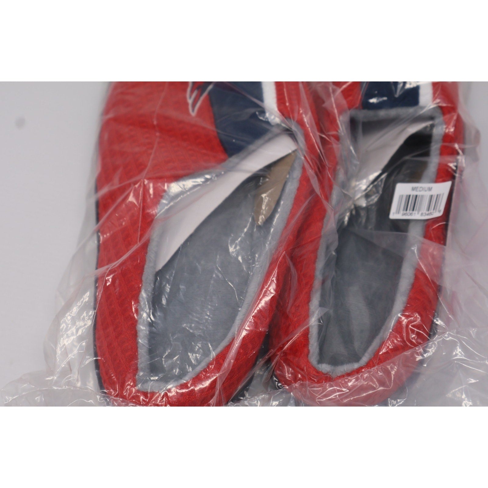 Packaged FOCO Washington Capitals slippers with team logo and colors