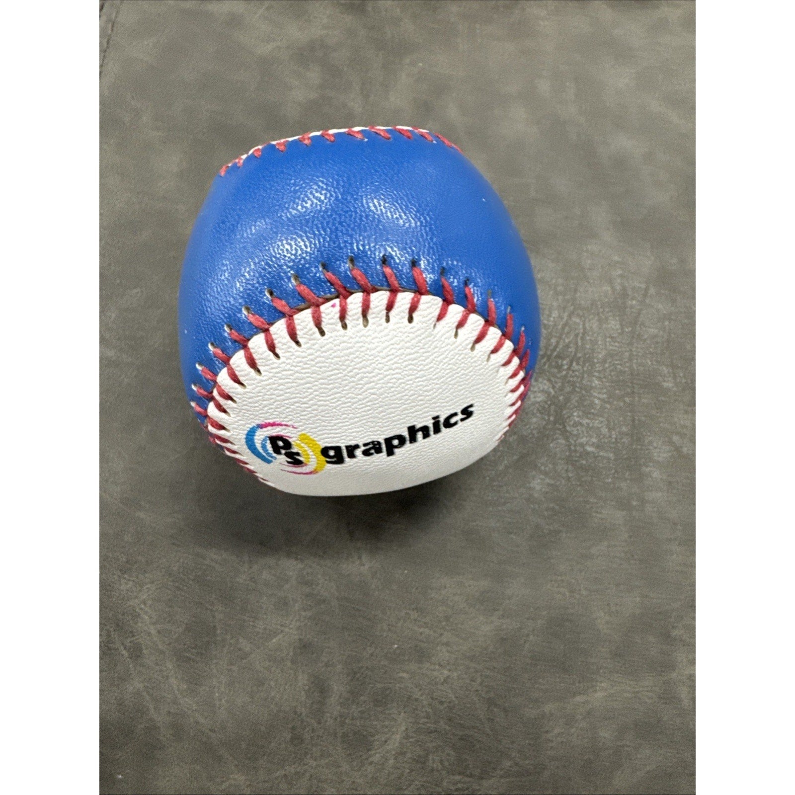 Side view of Aberdeen IronBirds collectible souvenir baseball with colored stitching