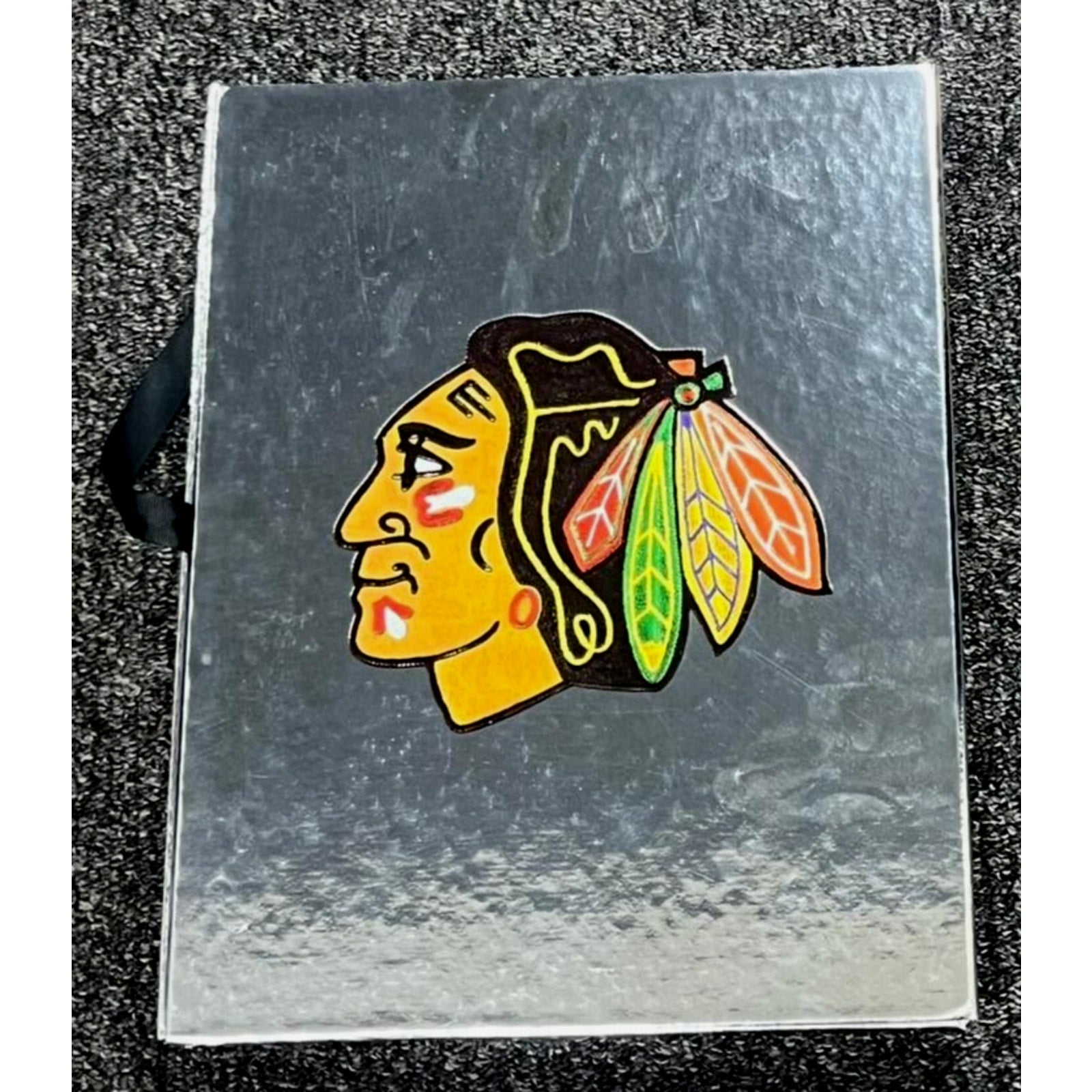 Chicago Blackhawks logo displayed on protective commemorative book case