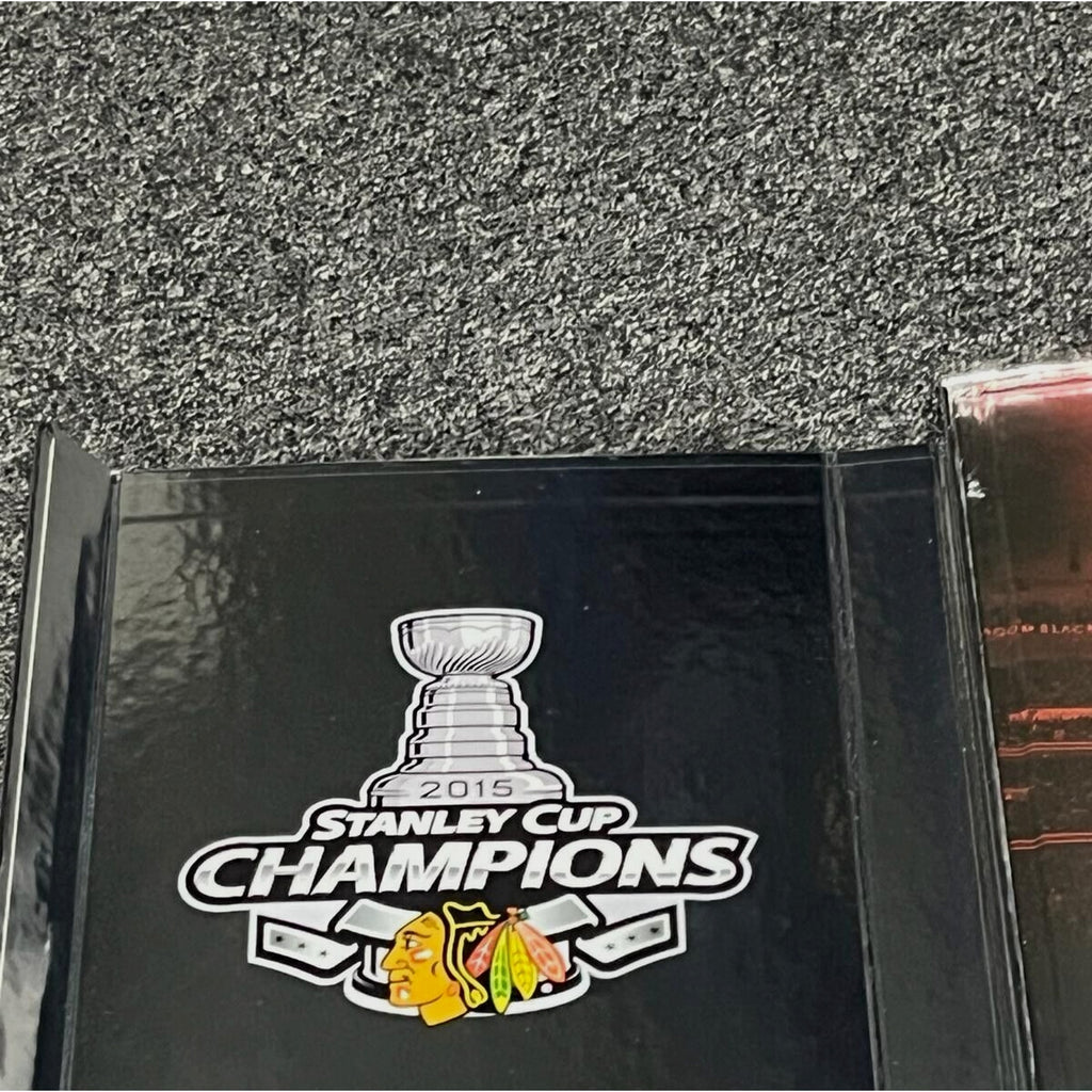 Champions commemorative branding on Chicago Blackhawks One Goal Achieved III display case
