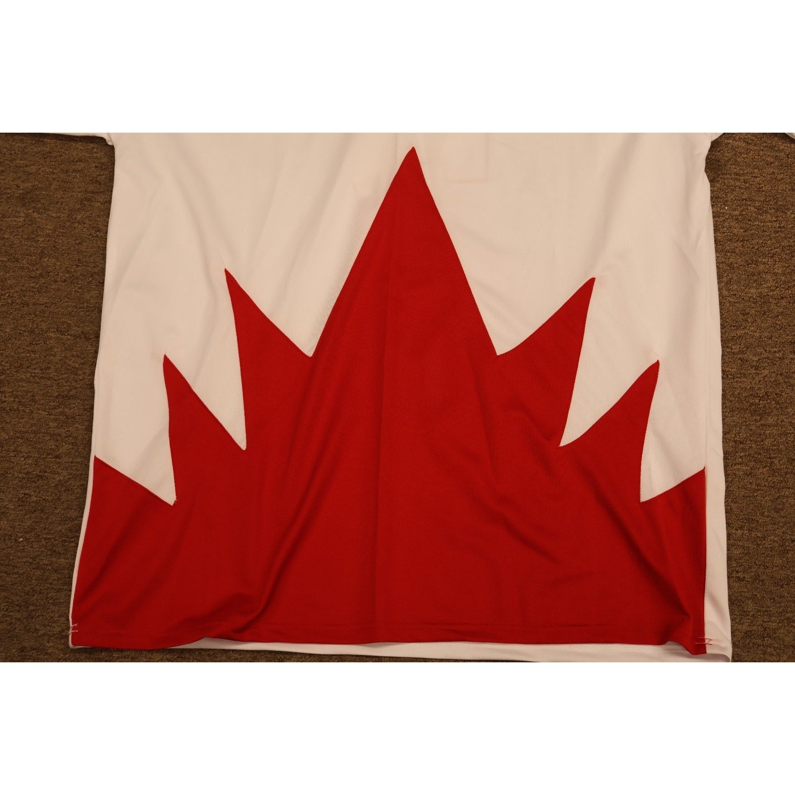 Detailed red maple leaf design on Team Canada Summit Series hockey jersey