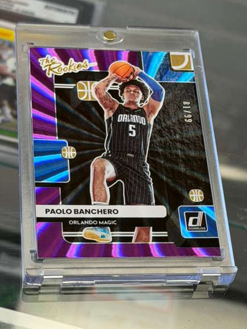 2022-23 Donruss The Rookies Paolo Banchero Purple Laser /99 card angled front view showcasing vibrant laser parallel finish