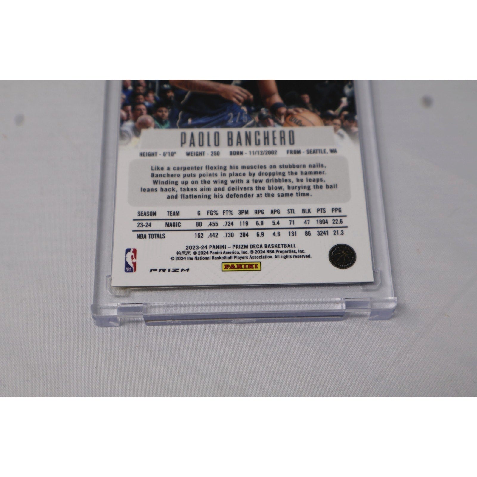 Back close-up of Paolo Banchero 2023 Panini Prizm Deca rookie card with authentication and card details