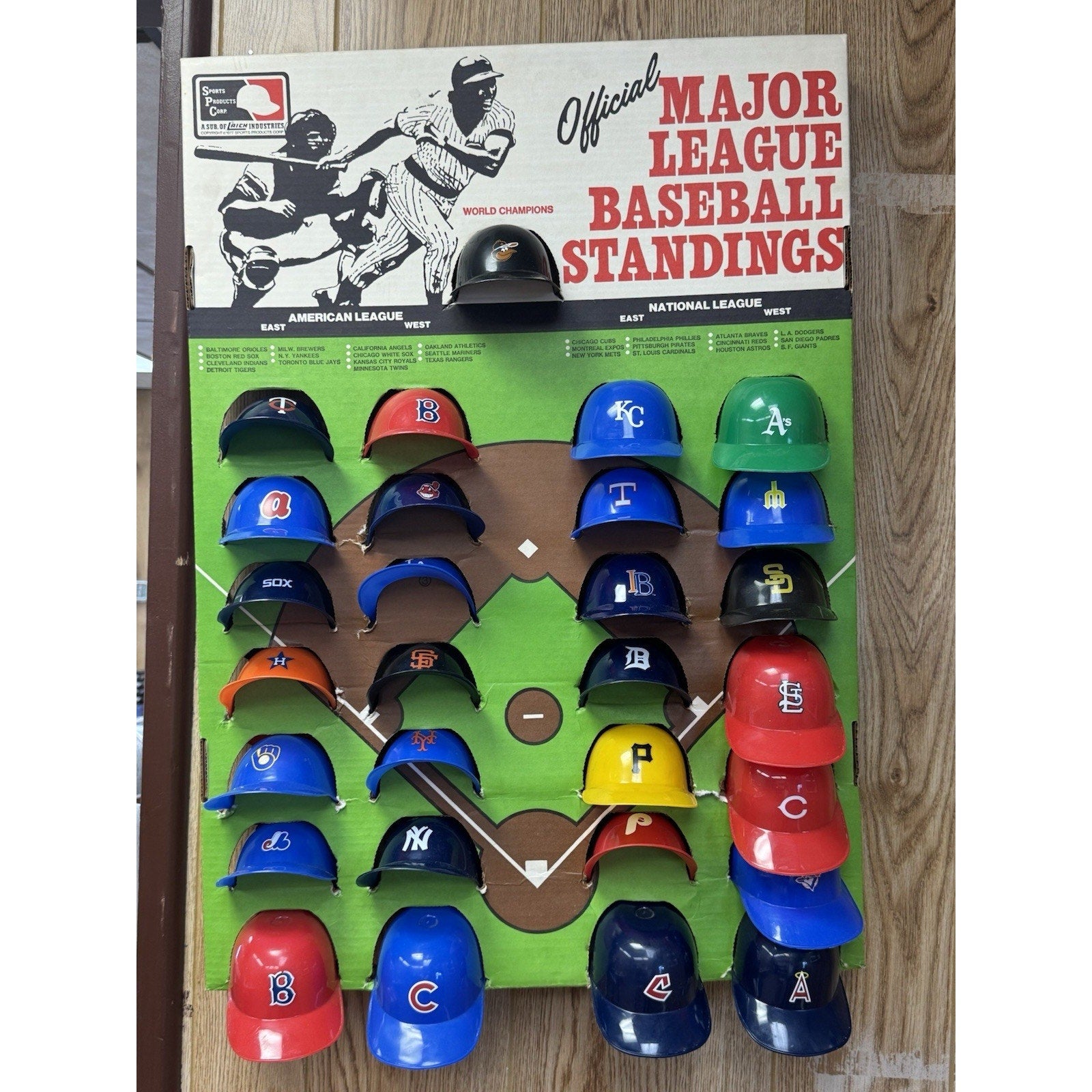 Rare vintage 1977 Major League Baseball cap hat standings board display with colorful MLB team helmet markers