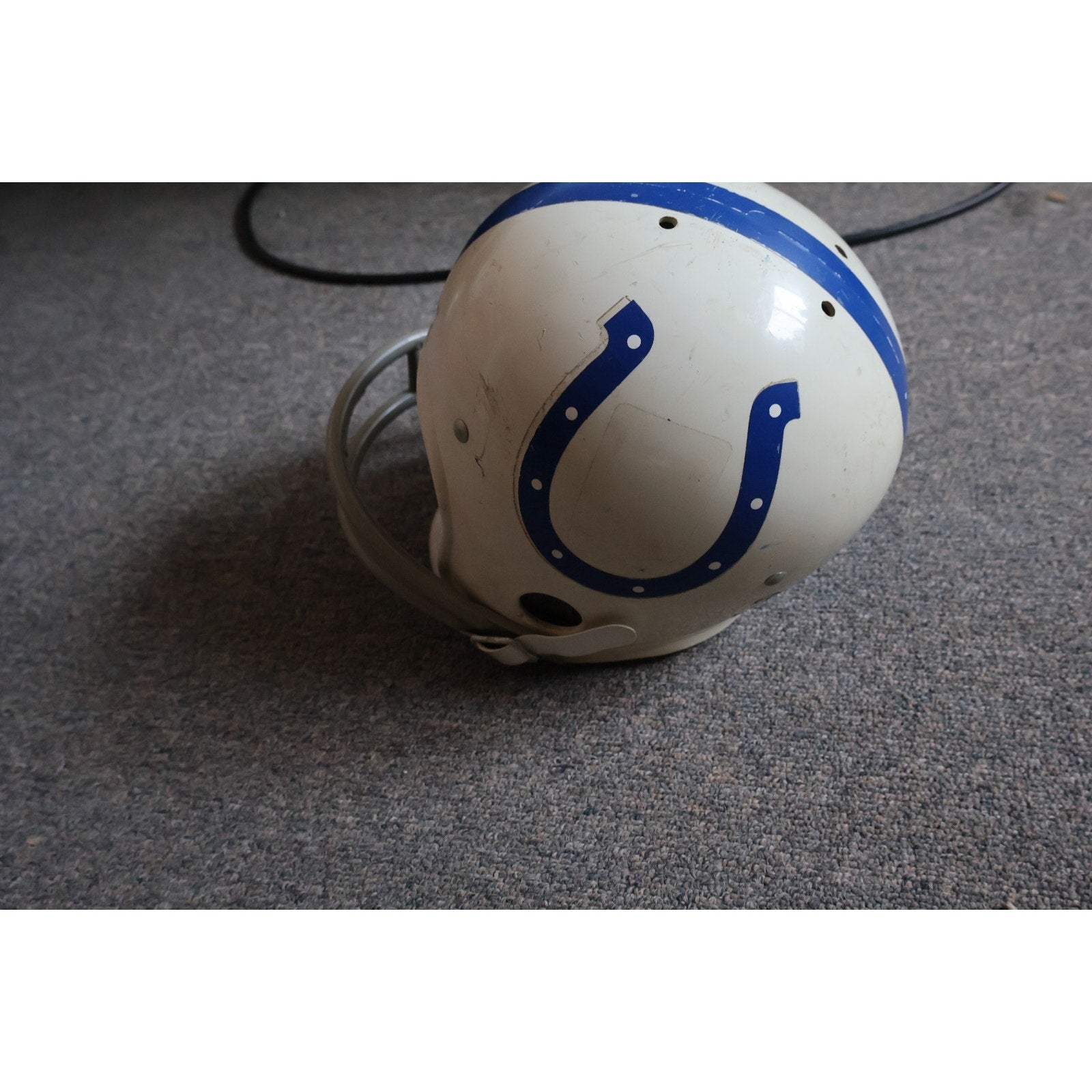 Side angle view of vintage Baltimore Colts youth football helmet collectible