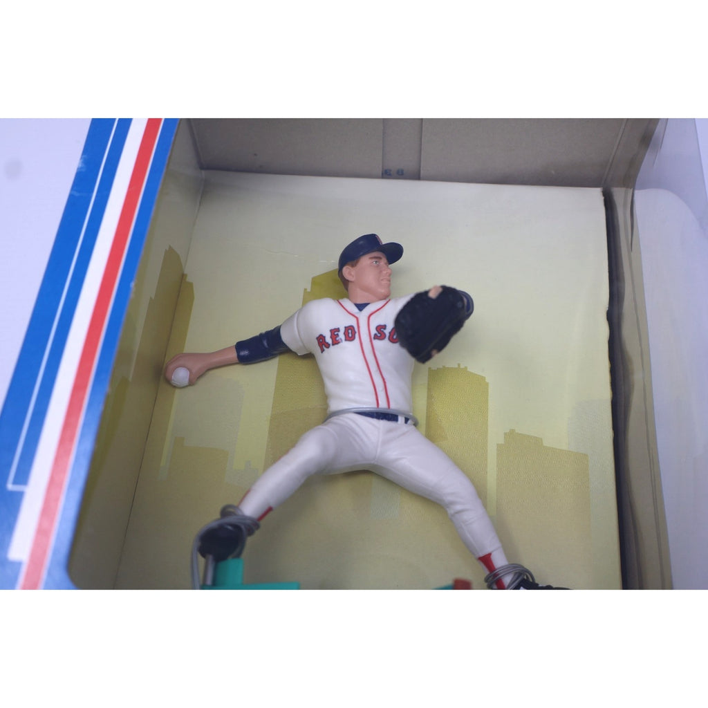 Close-up angled view of Roger Clemens Starting Lineup figure inside sealed Fenway Park packaging