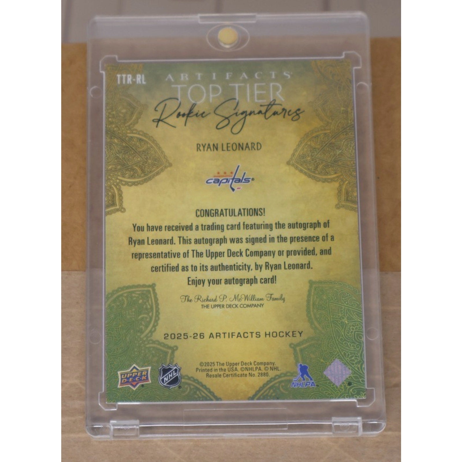 Back of Ryan Leonard UD Artifacts autograph rookie card showing authentication and player details
