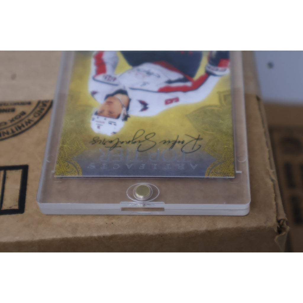 Close-up angled image of Ryan Leonard autograph and gold foil design