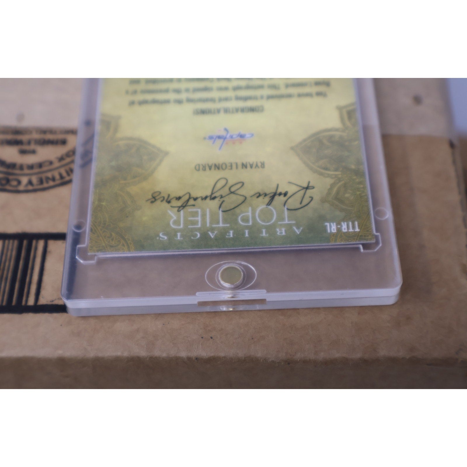 Rear angled view of Ryan Leonard Upper Deck Artifacts autograph card