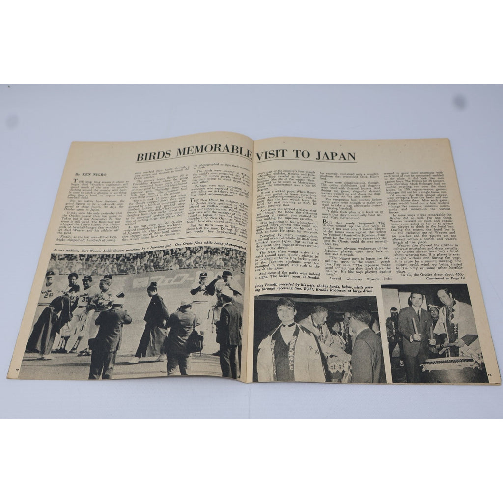 Interior newspaper spread featuring Baltimore Orioles articles and photography