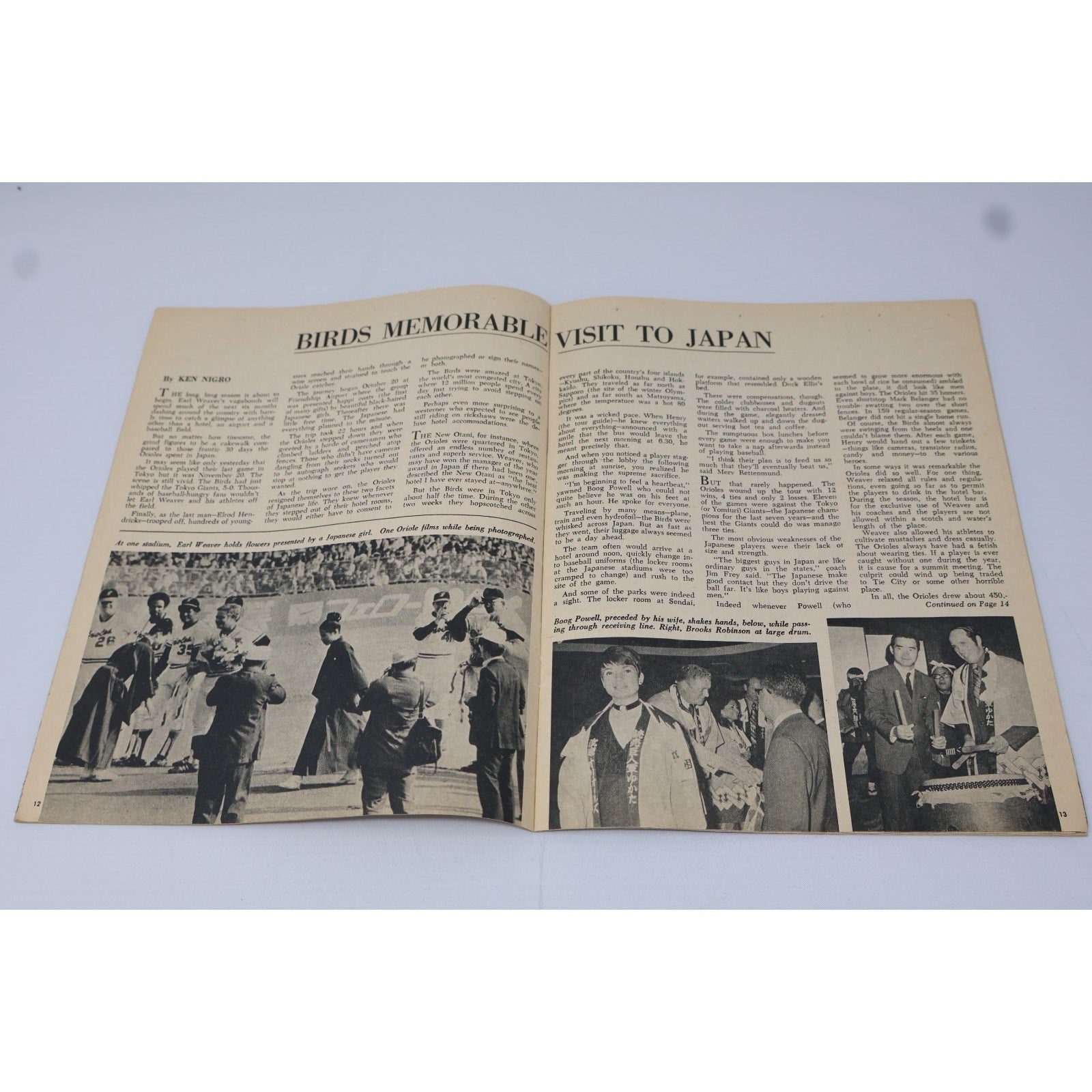 Interior newspaper spread featuring Baltimore Orioles articles and photography