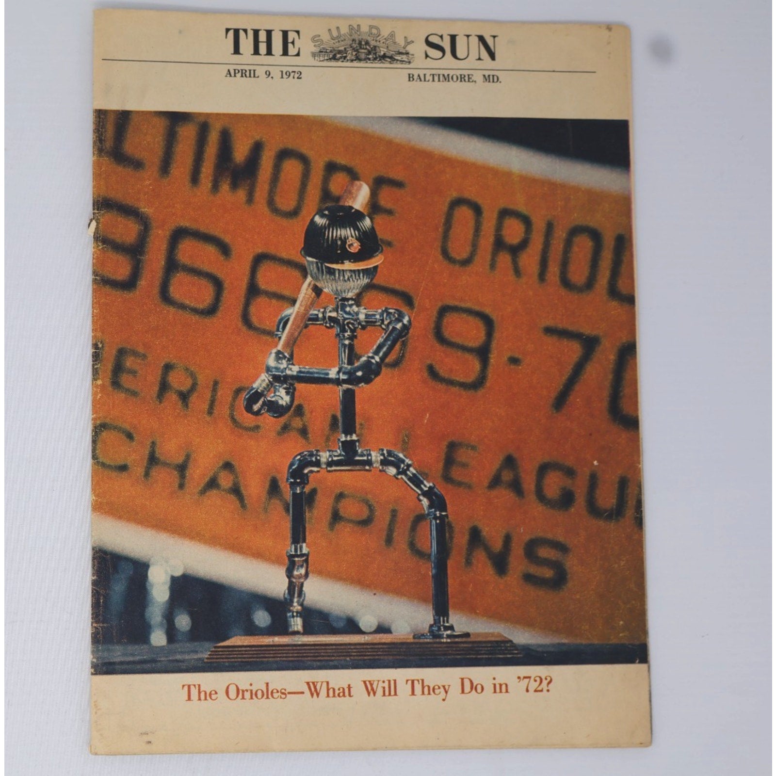Close-up of 1972 Orioles season preview supplement cover with championship headline