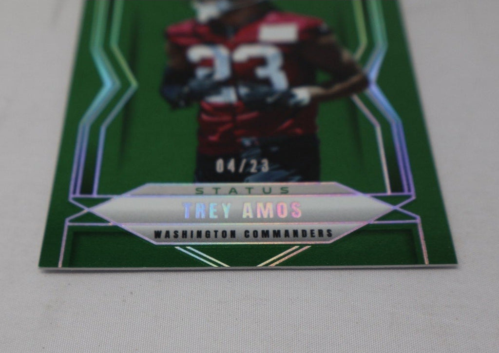Close-up angled view of Trey Amos green parallel rookie card