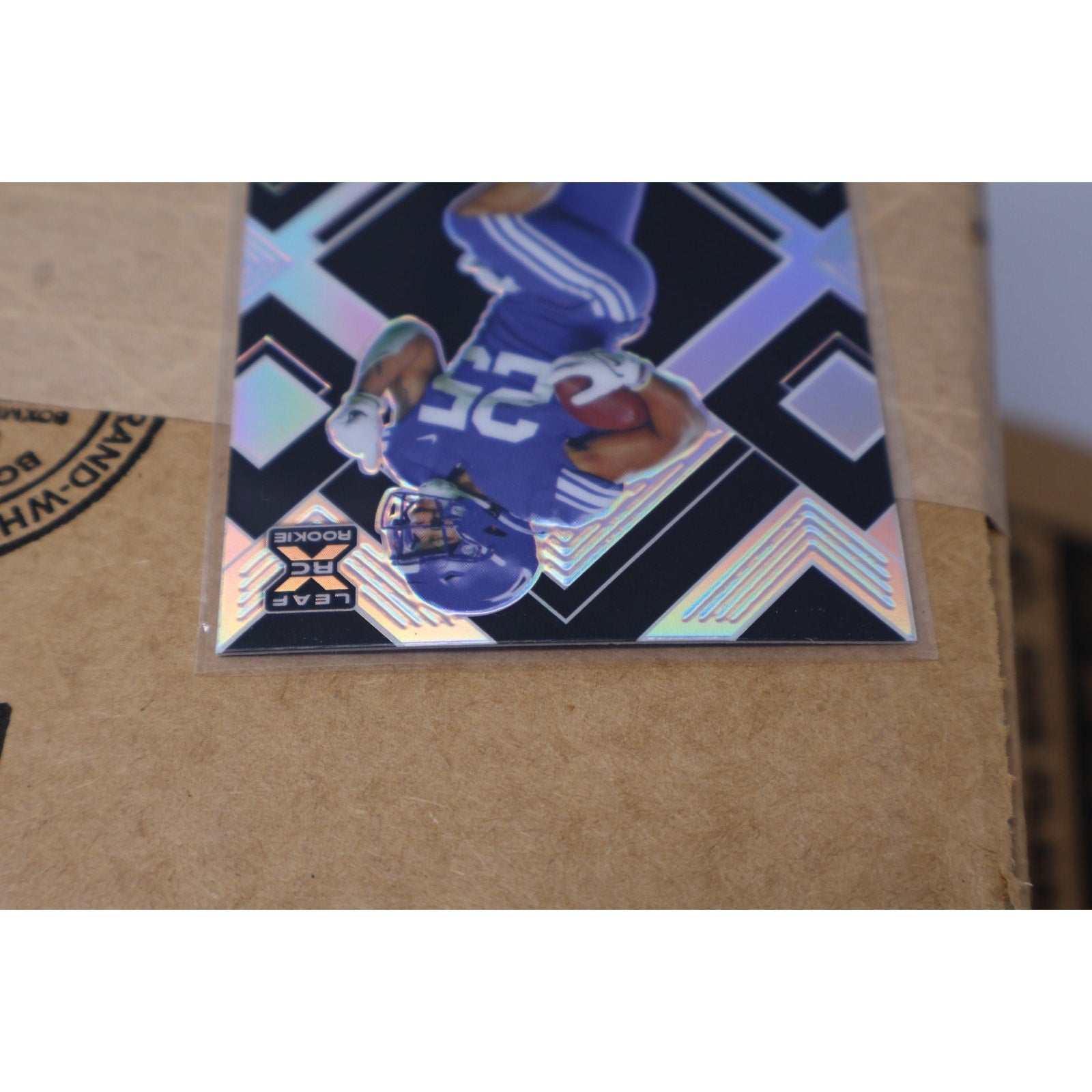 Angled front display of Tyler Allgeier Black Crystals rookie autograph card