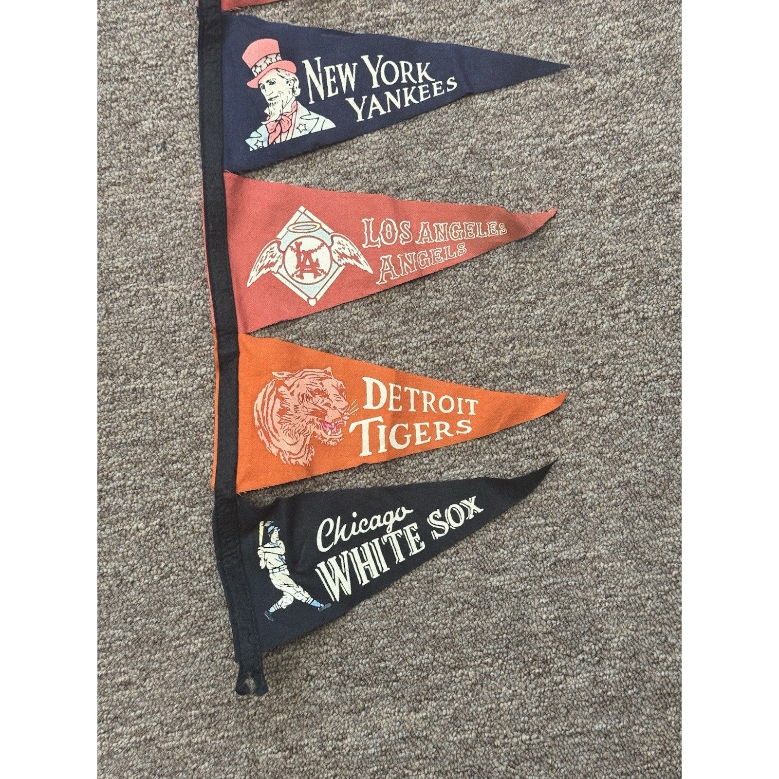 Close-up of vintage MLB American League mini pennants on attached felt display
