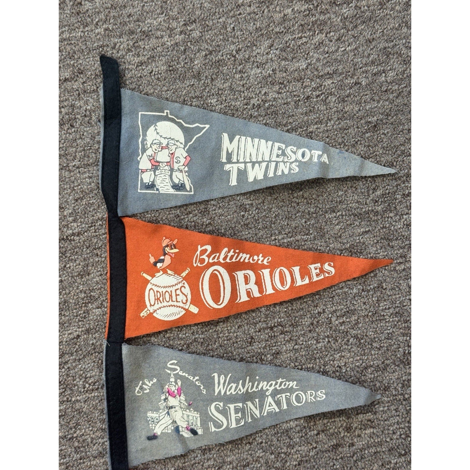 Top section of vintage MLB mini pennant display featuring classic teams