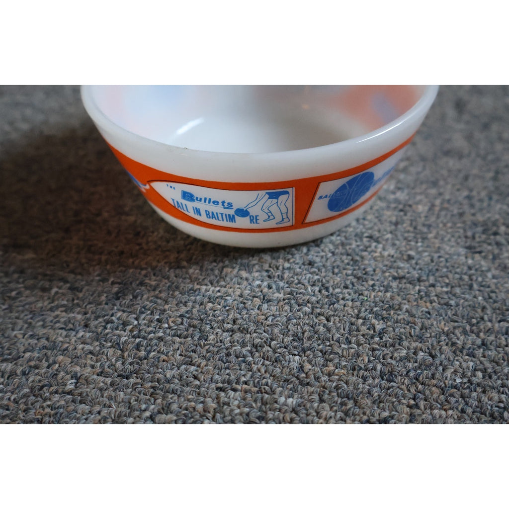 Side angle view of vintage Baltimore Bullets Westfield white glass collectible bowl