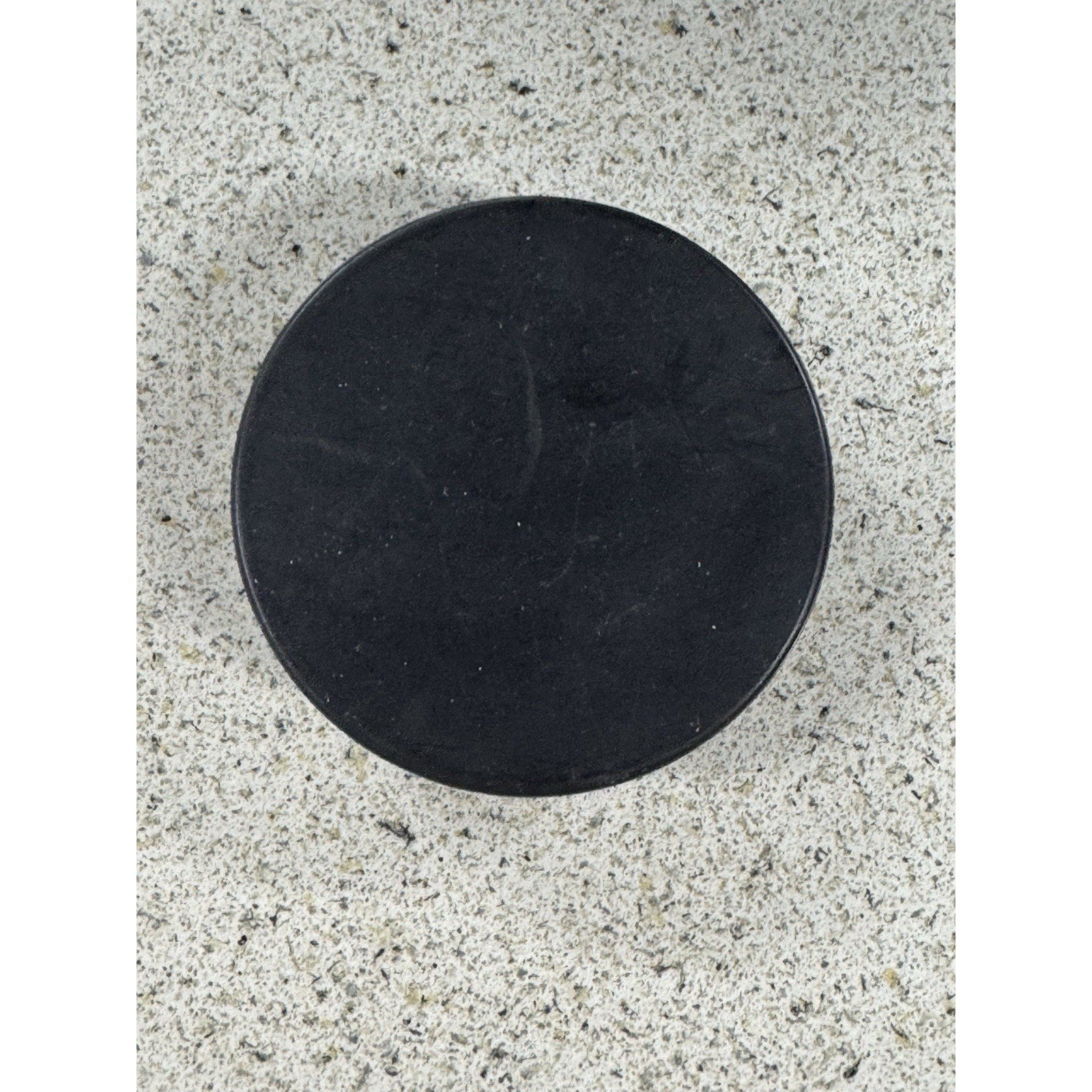 Back side of vintage Washington Capitals NHL puck collectible
